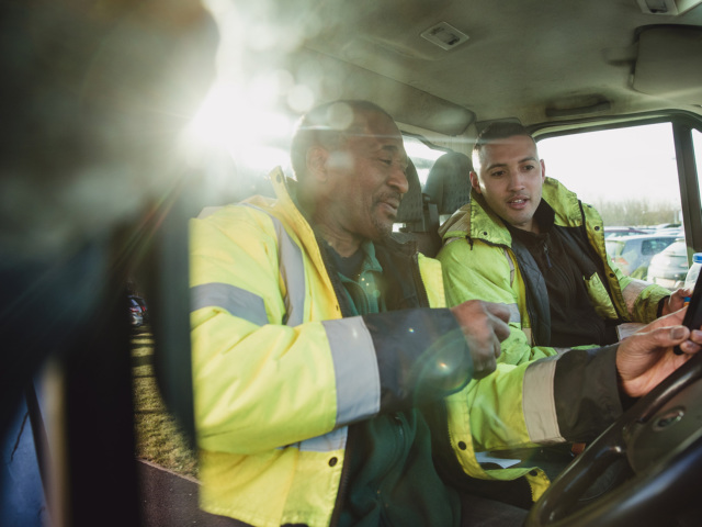 Delivery team personnel in conversation