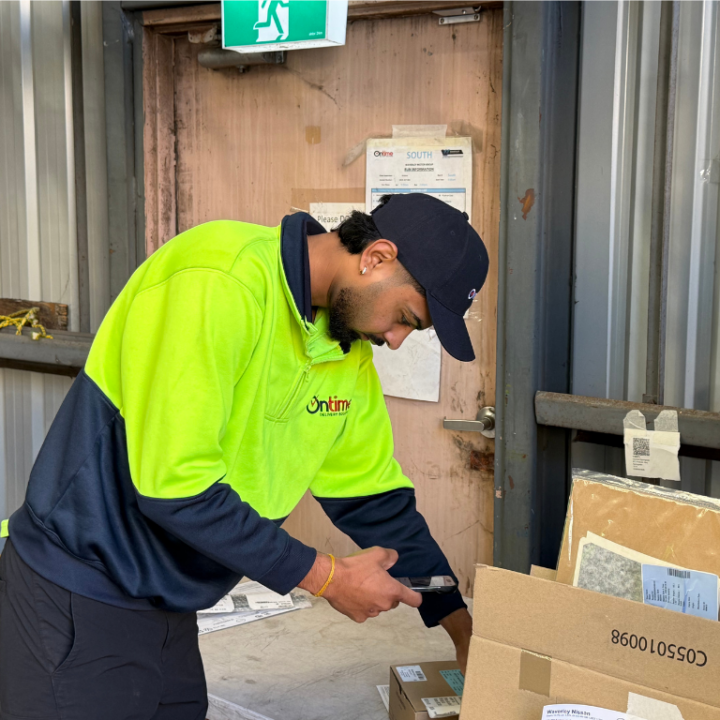 A delivery partner taking proof of delivery.