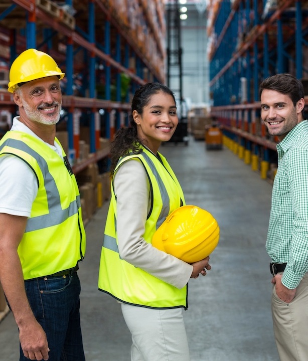 Portrait of warehouse team standing together