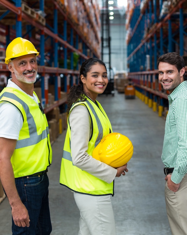 Portrait of warehouse team standing together