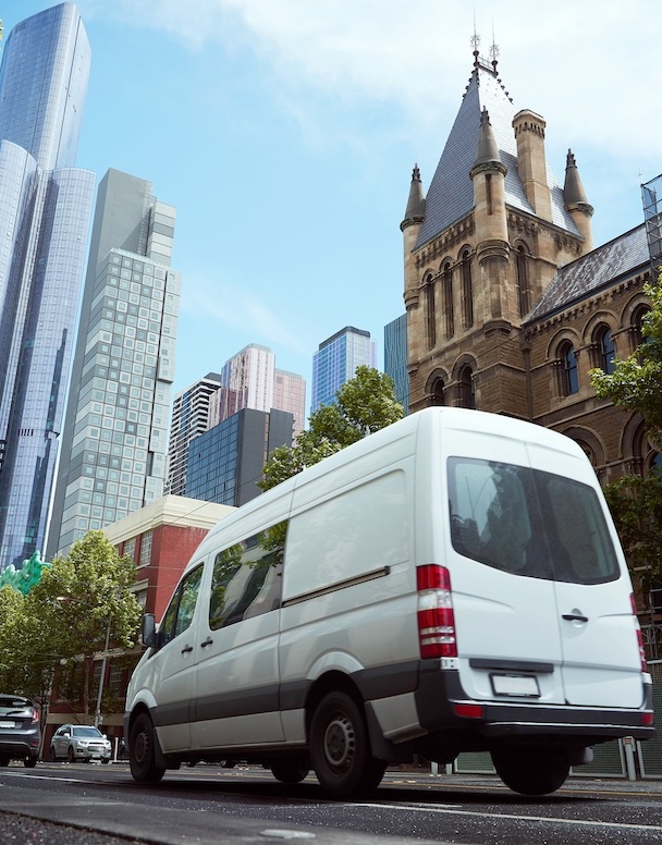 Delivery white van in the city street