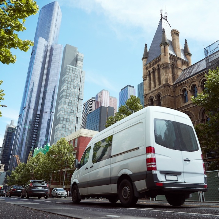 Delivery white van in the city street